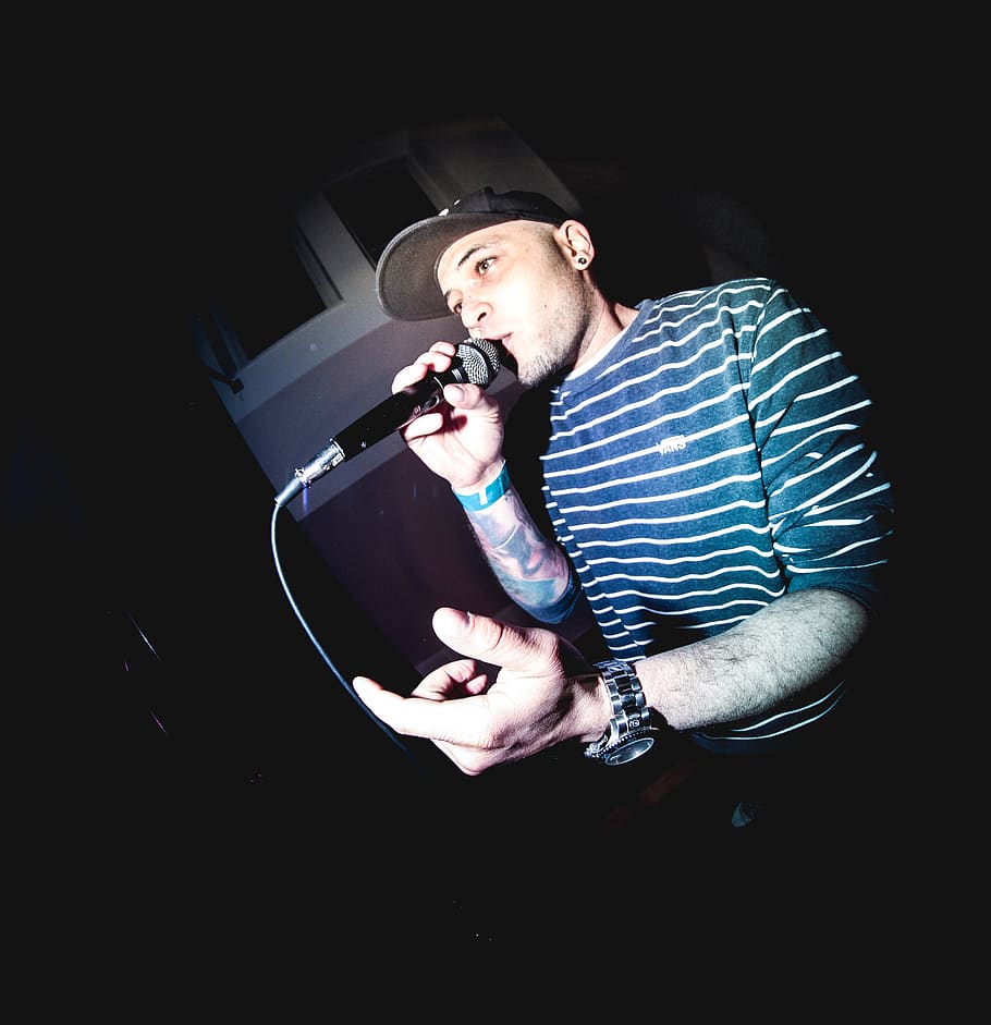 man holding microphone, person, human, skin, musical instrument HD wallpaper