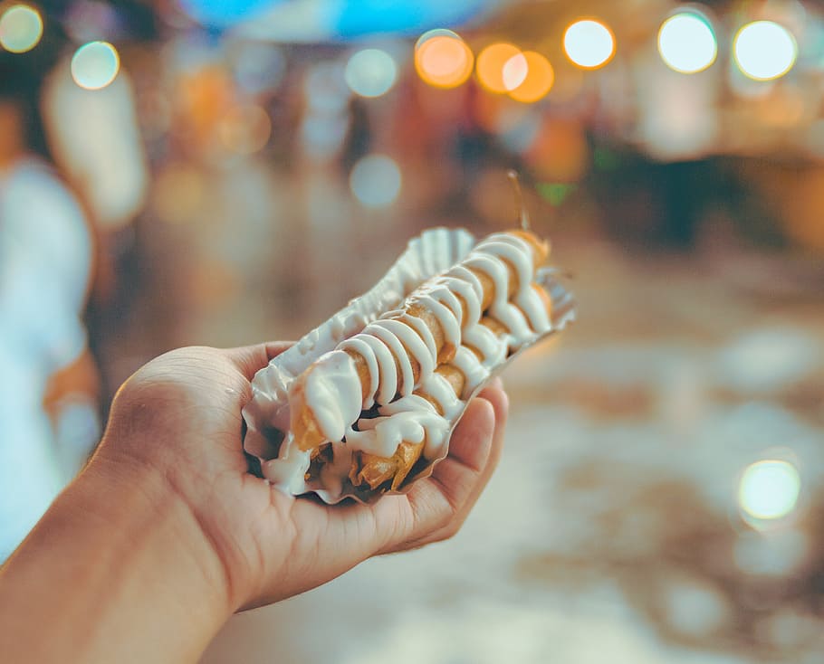 Bokeh Photo of Person Holding Shanghai Roll Wraps With Mayonnaise HD wallpaper