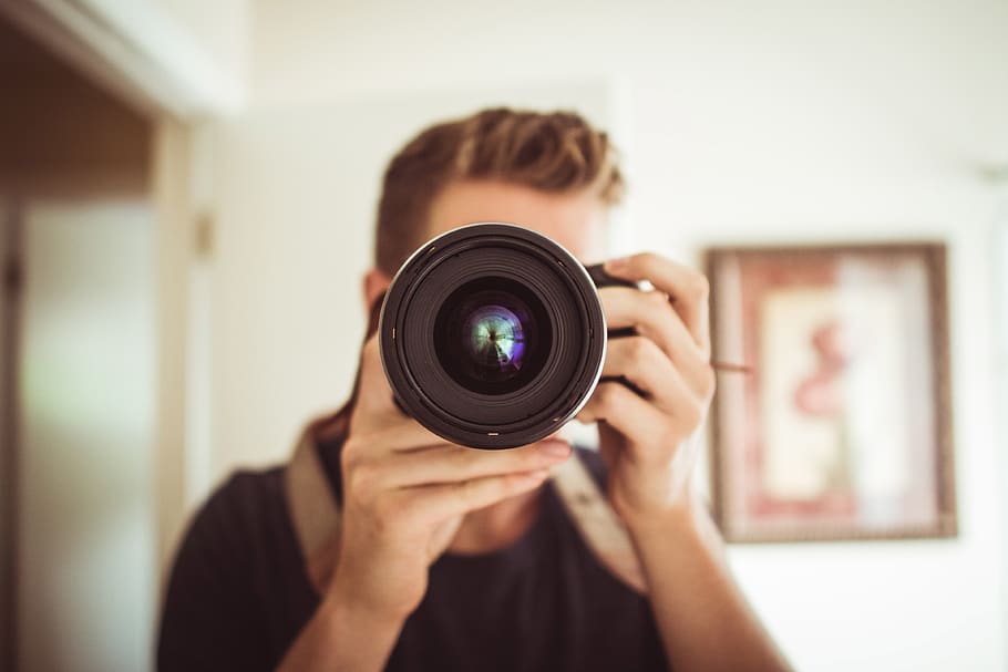 Person Holding Dslr Camera, camera lens, focus, hands, hobby HD wallpaper