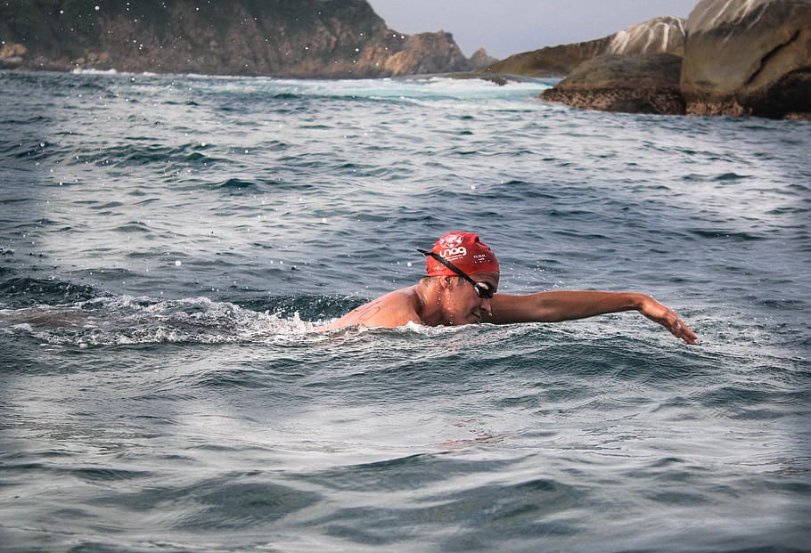 man swimming during daytime, clothing, apparel, human, person HD wallpaper