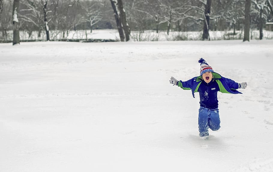 boy running on snow while opening his mouth, apparel, clothing