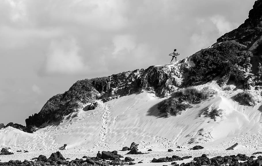 Person Holding Surfboard on Cliff, black and white, carrying HD wallpaper