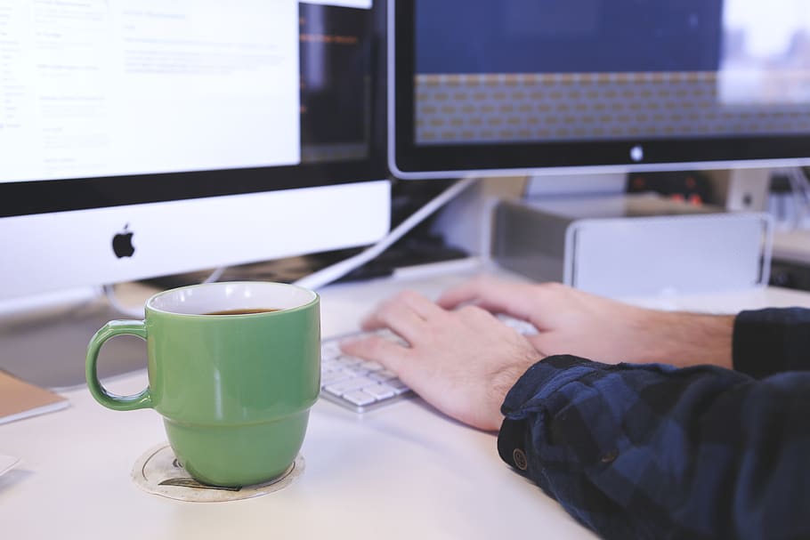 Person Typing on Apple Magic Keyboard in Front of Imac, coffee HD wallpaper