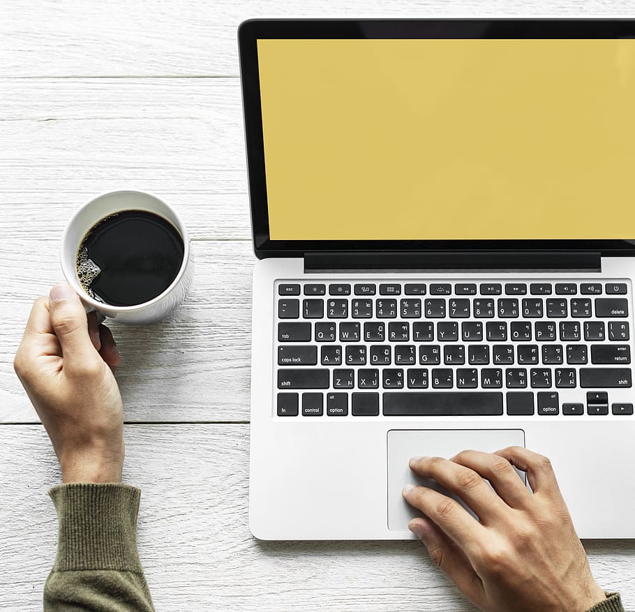 Person's Hand on Laptop and Holding Coffee, computer, device HD wallpaper
