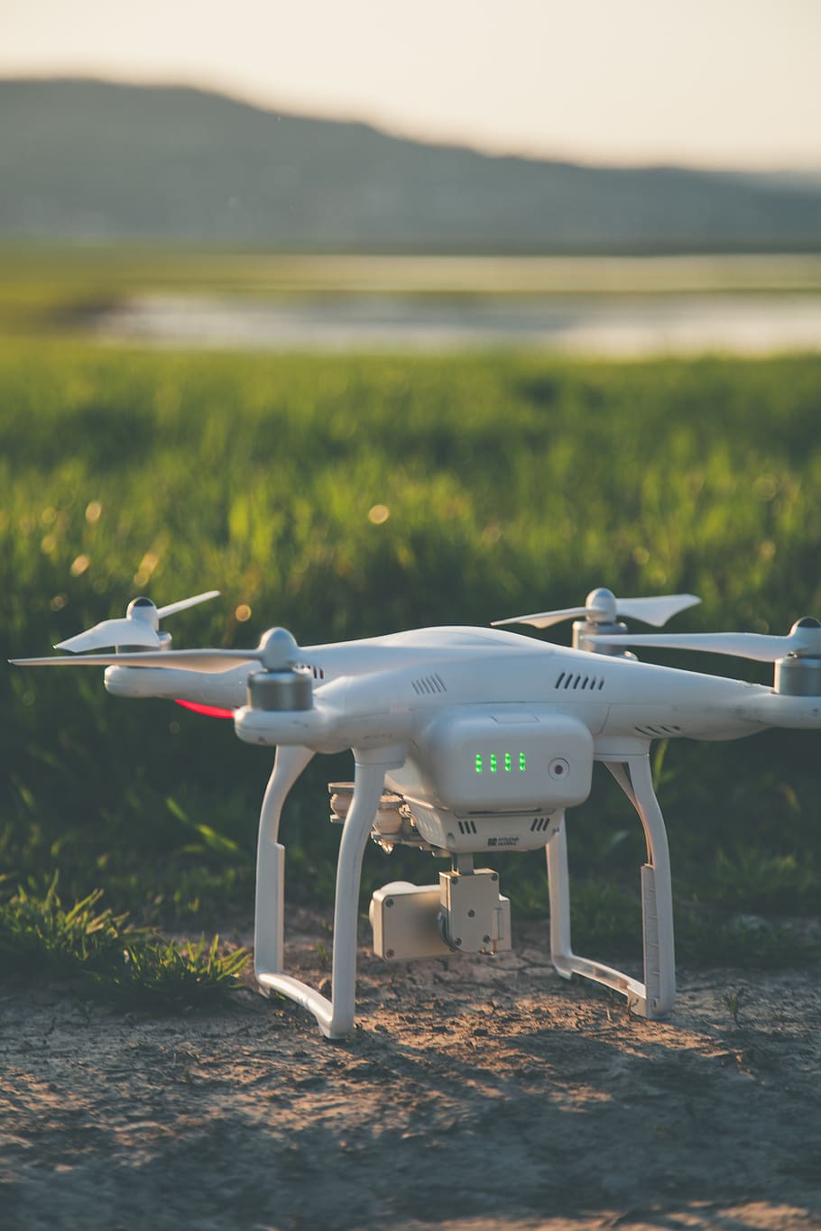 White and Gray Quadcopter on Ground, aircraft, aviation, blurred background HD wallpaper