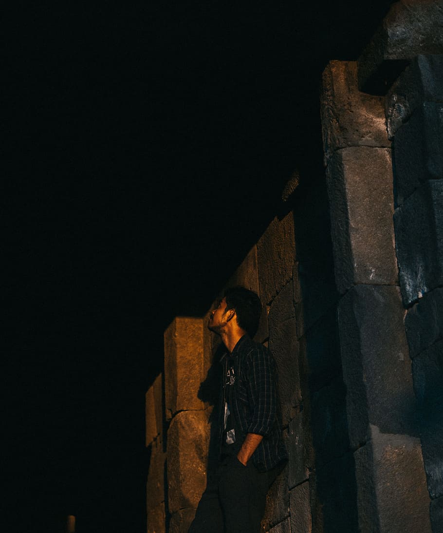 Photo of Man Leaning on Wall at Night-time, looking up, outdoors HD wallpaper