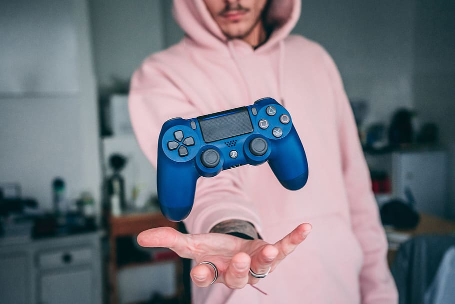 person holding blue Sony PS4 Dualshock 4 c, skill, photoshop