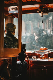 Man Wearing Black Jacket Driving Brown Bus, boat, captain, chair HD wallpaper
