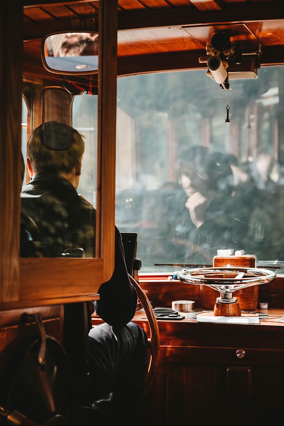 Man Wearing Black Jacket Driving Brown Bus, boat, captain, chair HD wallpaper