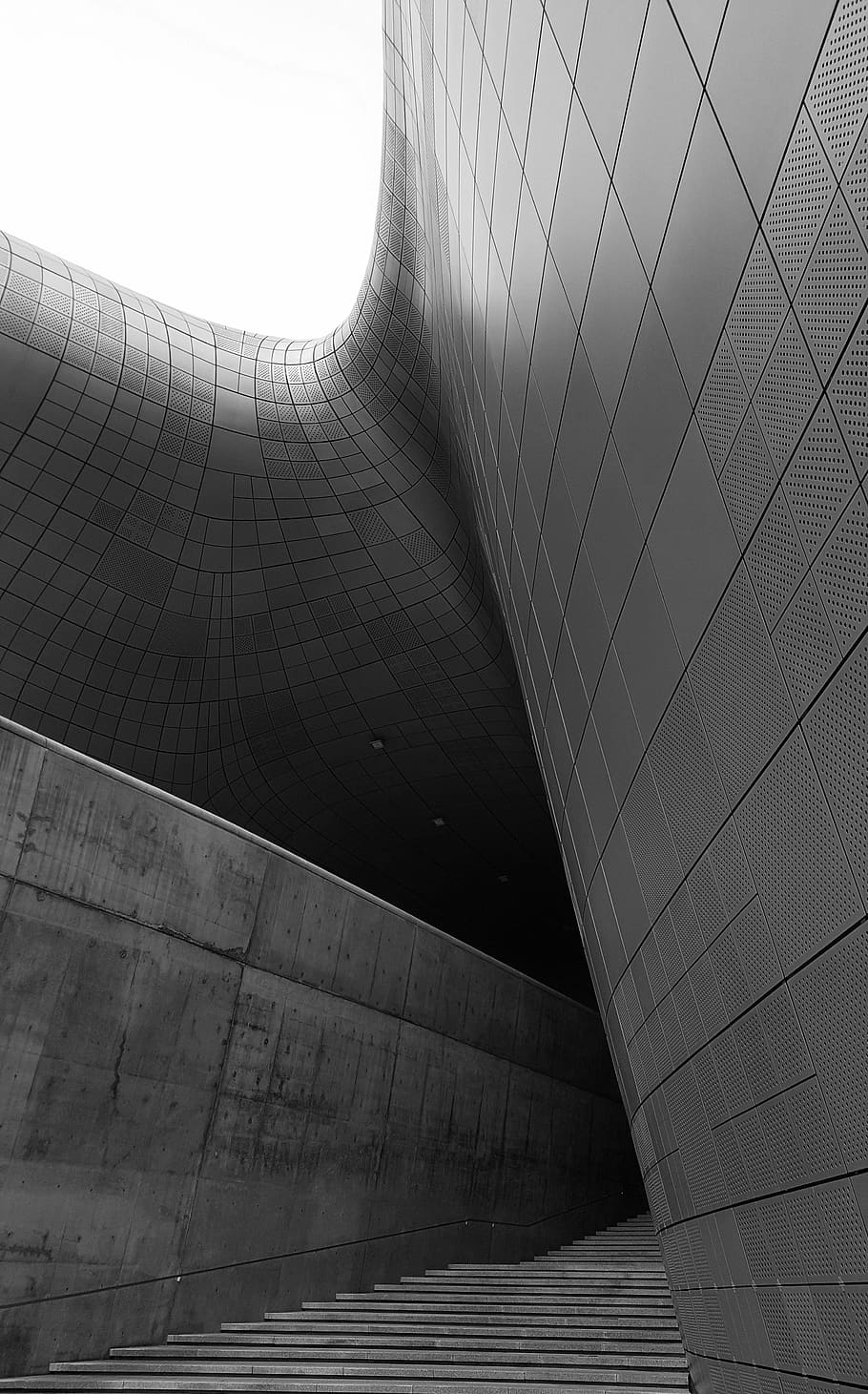 gray concrete building, dongdaemun design plaza, south korea