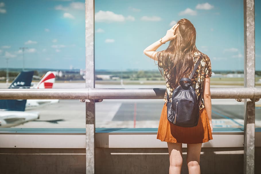 Vacation is beginning. Young female passenger at the airport. HD wallpaper