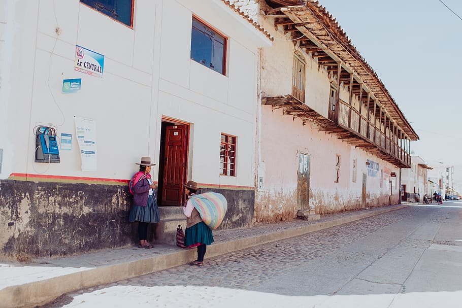 two women talking while standing near building duting daytime, HD wallpaper