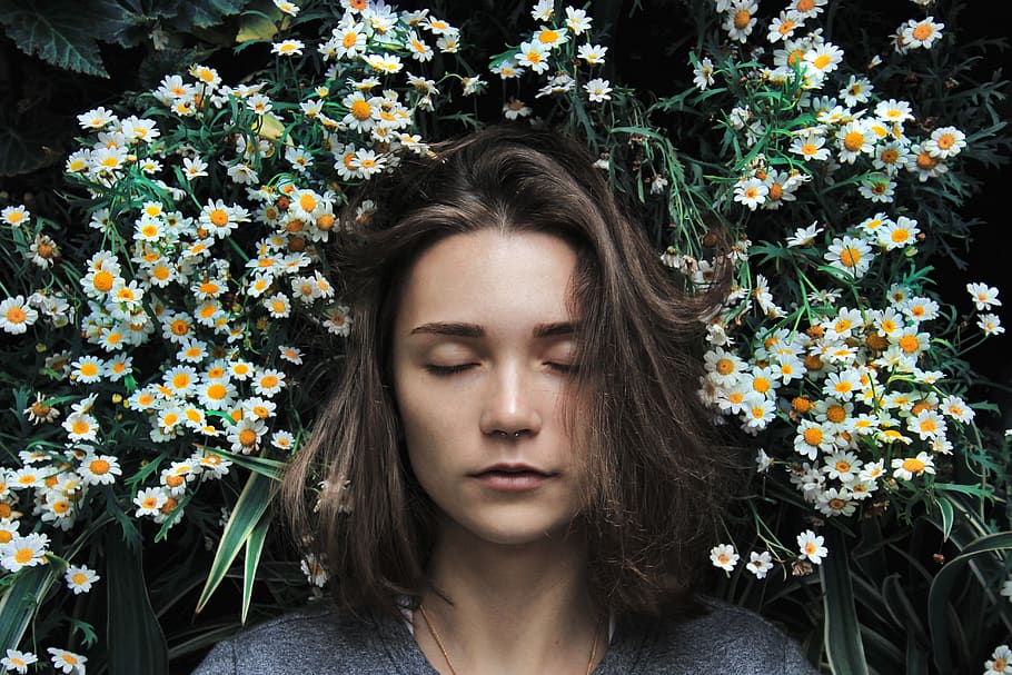 woman closing her eyes on white flower, person, human, people