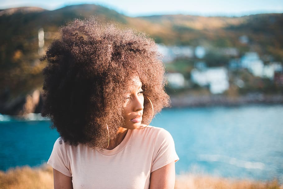 woman taking pose, ocean, water, portrait, hair, curly, afro