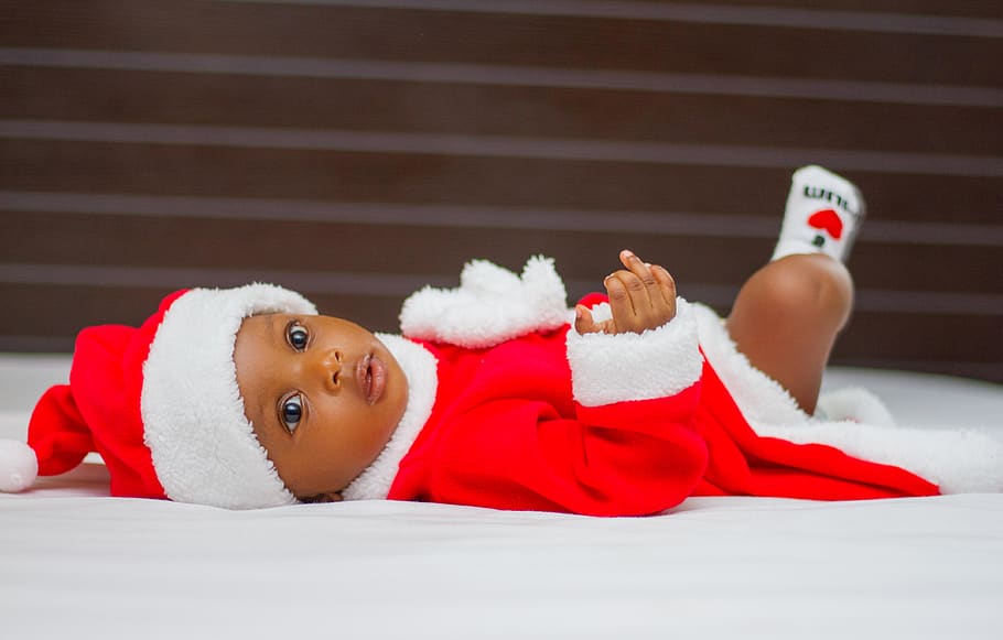 Baby Wearing Santa Claus Costume While Lying on Bed, boy, child