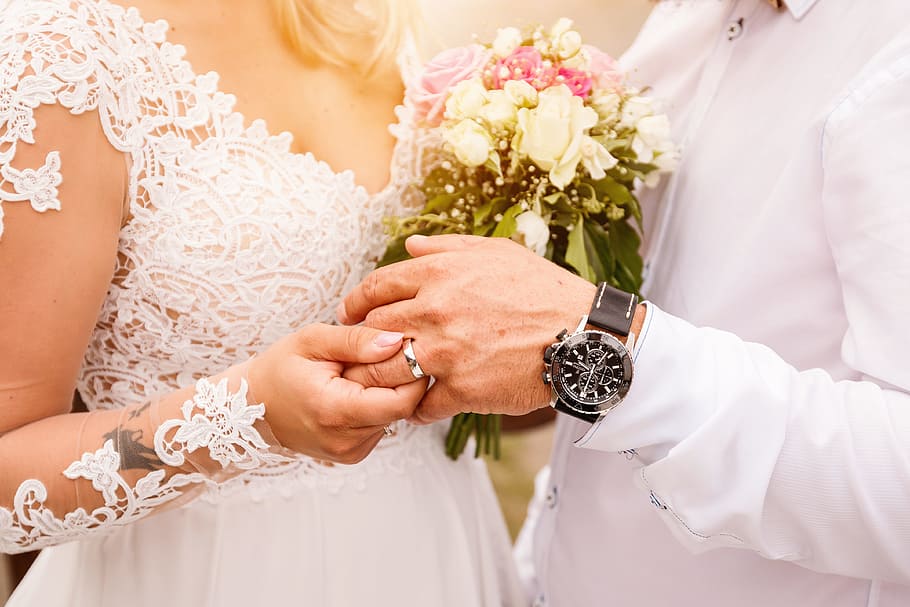 Close up Bride Put the Wedding Ring on groom. Romantic atmosphere HD wallpaper
