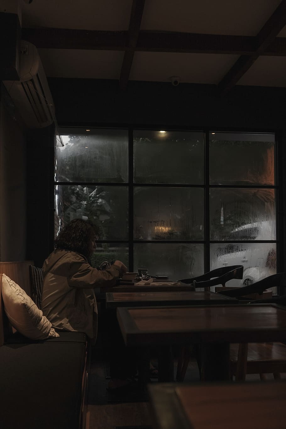 human, person, home decor, cafe, furniture, couch, window, sad