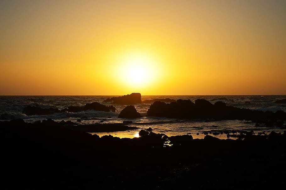 seashore with rocks with sunset view, light, nature, flare, sky HD wallpaper