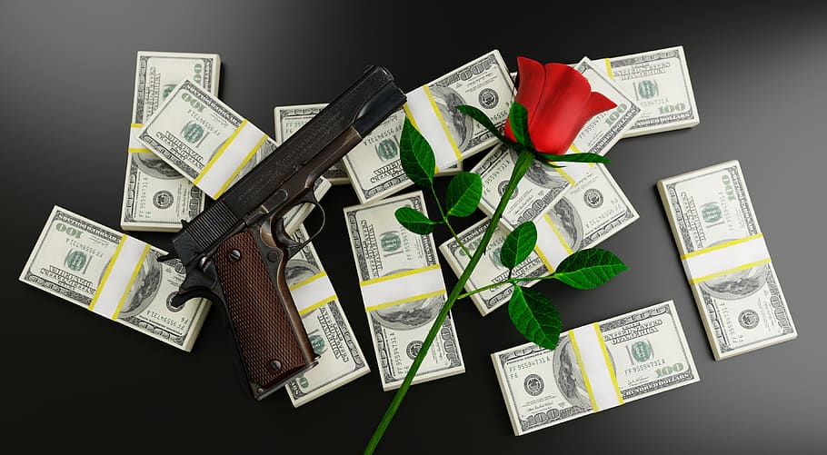 Gun And Bullets On Casino Table With Money And Gambling Objects Stock Photo   Download Image Now  iStock