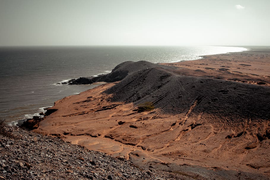 Brown Terrain Near Body of Water, beach, coast, coastline, daylight HD wallpaper