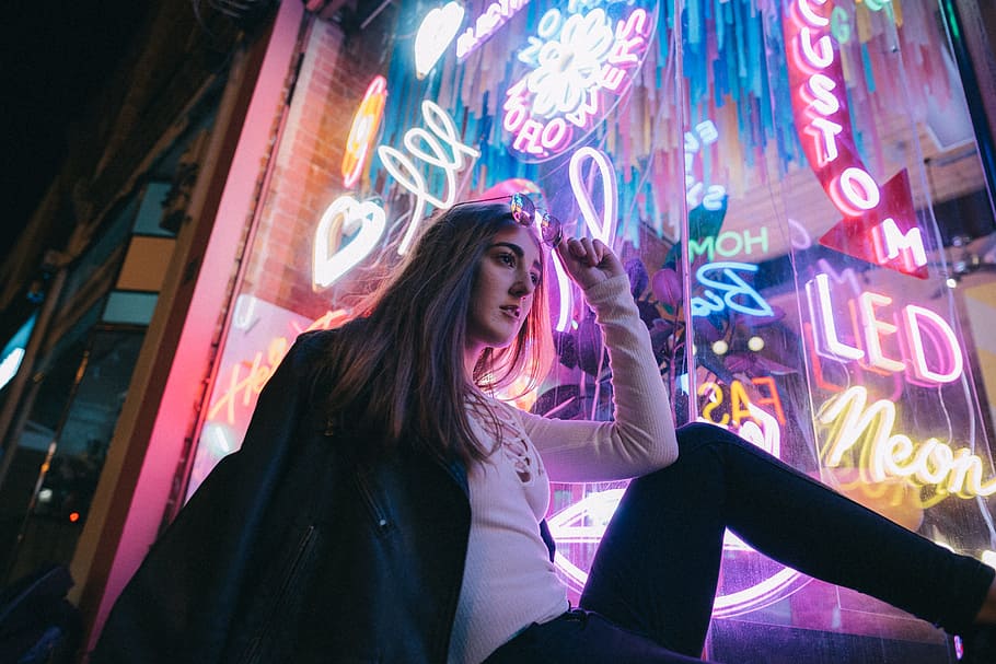 woman sitting beside LED wall, australia, melbourne, girl, neon