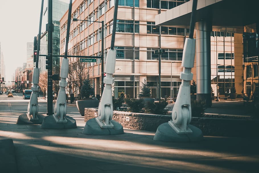 four white concrete posts on sidewalk, office building, car, automobile HD wallpaper