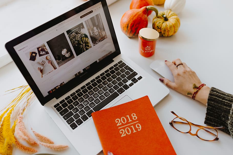 Female desk with orange notebook and pumpkins, laptop, computer HD wallpaper