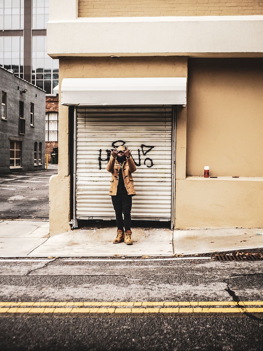 Man Standing in Front of Roller Shutter, asphalt, fashion, fashionable, HD wallpaper