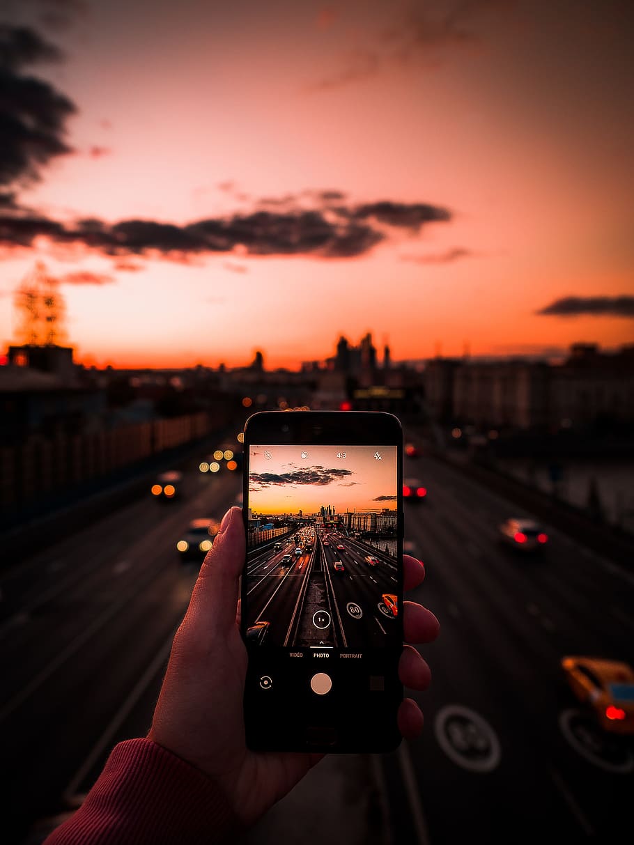 selective focus photo of vehicles on highway during golden hour HD wallpaper