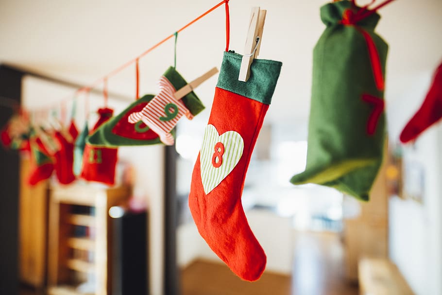 Red and Green Christmas Stocking Hanging Inside Room, art, celebration, HD wallpaper