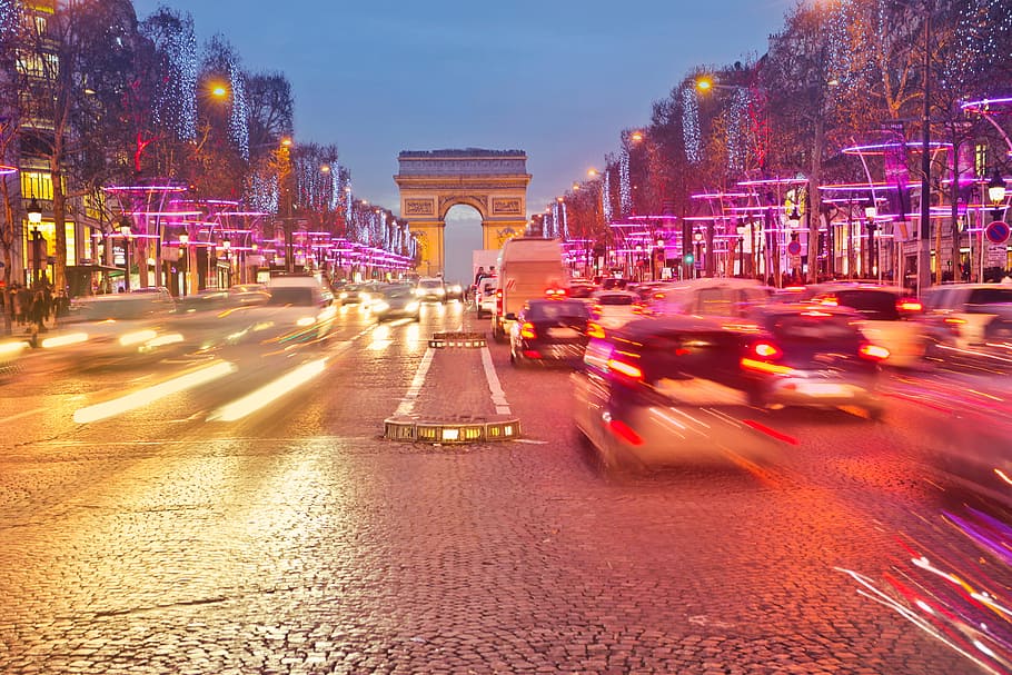 Night view of Arc de Triomphe with vehicle light trails effect HD wallpaper