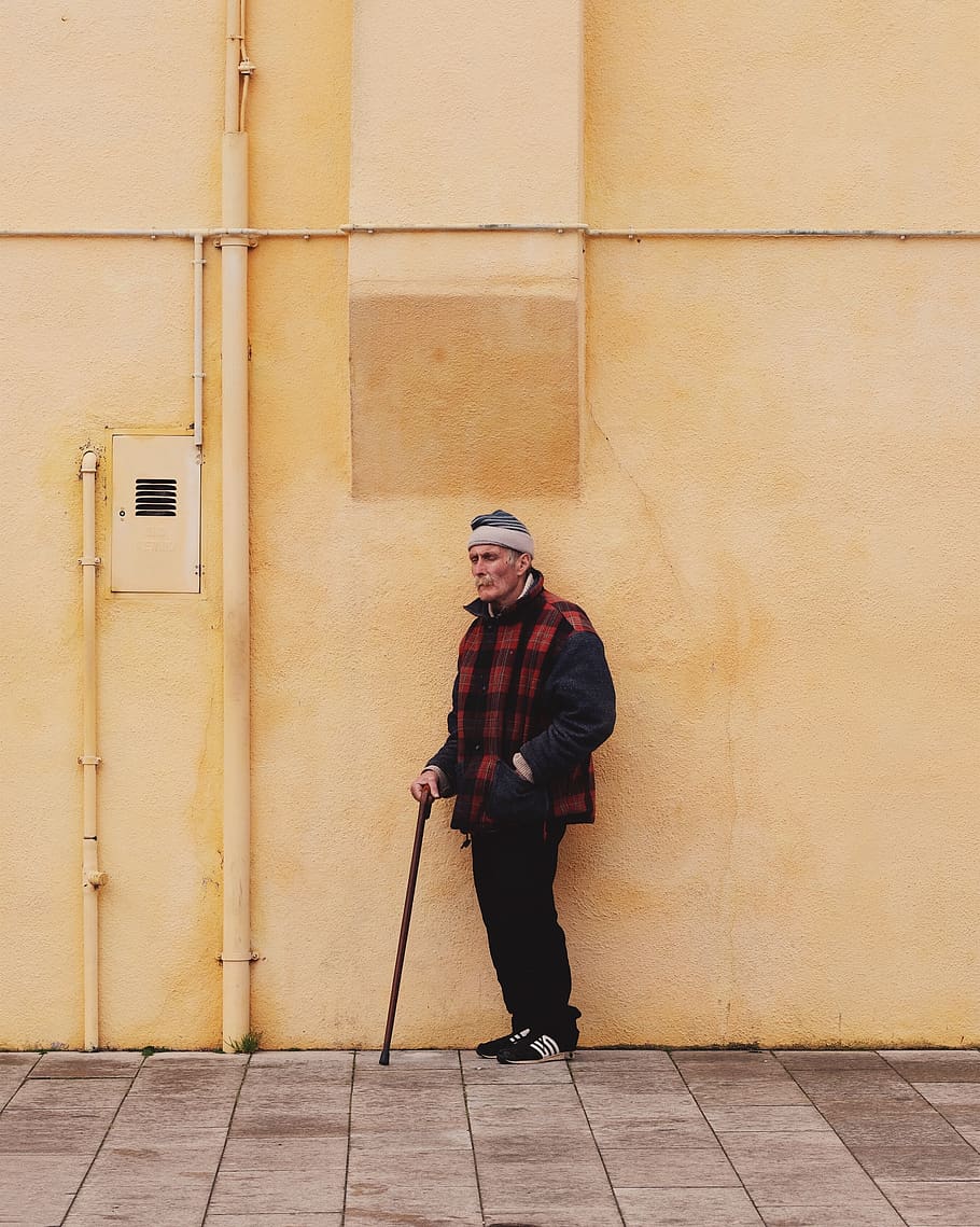 man standing yellow wall, person, human, apparel, clothing, burano HD wallpaper