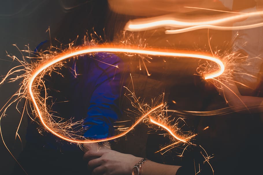 orange fireworks display, light, person, pattern, lighting, night HD wallpaper