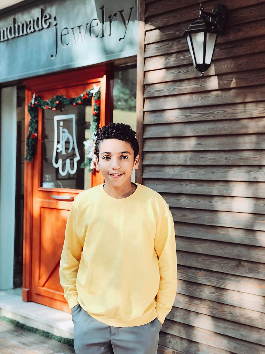 Photo of Smiling Boy Standing in Front of Jewelry Shop, kid, young HD wallpaper