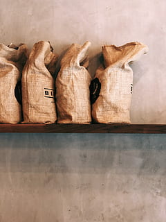 four brown sacks, bag, birch coffee, coffee bean, shelf, modern HD wallpaper