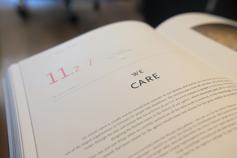 We Care Book Page, blur, composition, desk, education, learning HD wallpaper