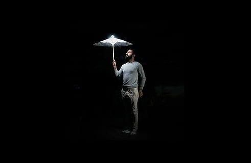 man holding umbrella, human, person, canopy, light, nature, clothing HD wallpaper