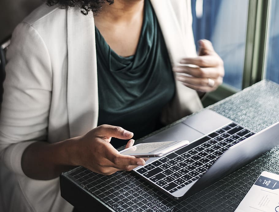 Woman Sitting Holding Smartphone And Facing Laptop, busy, computer HD wallpaper