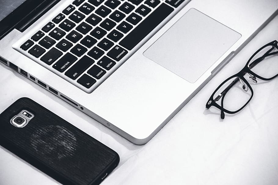 Macbook Beside Eyeglasses and Smartphone, black-and-white, data HD wallpaper