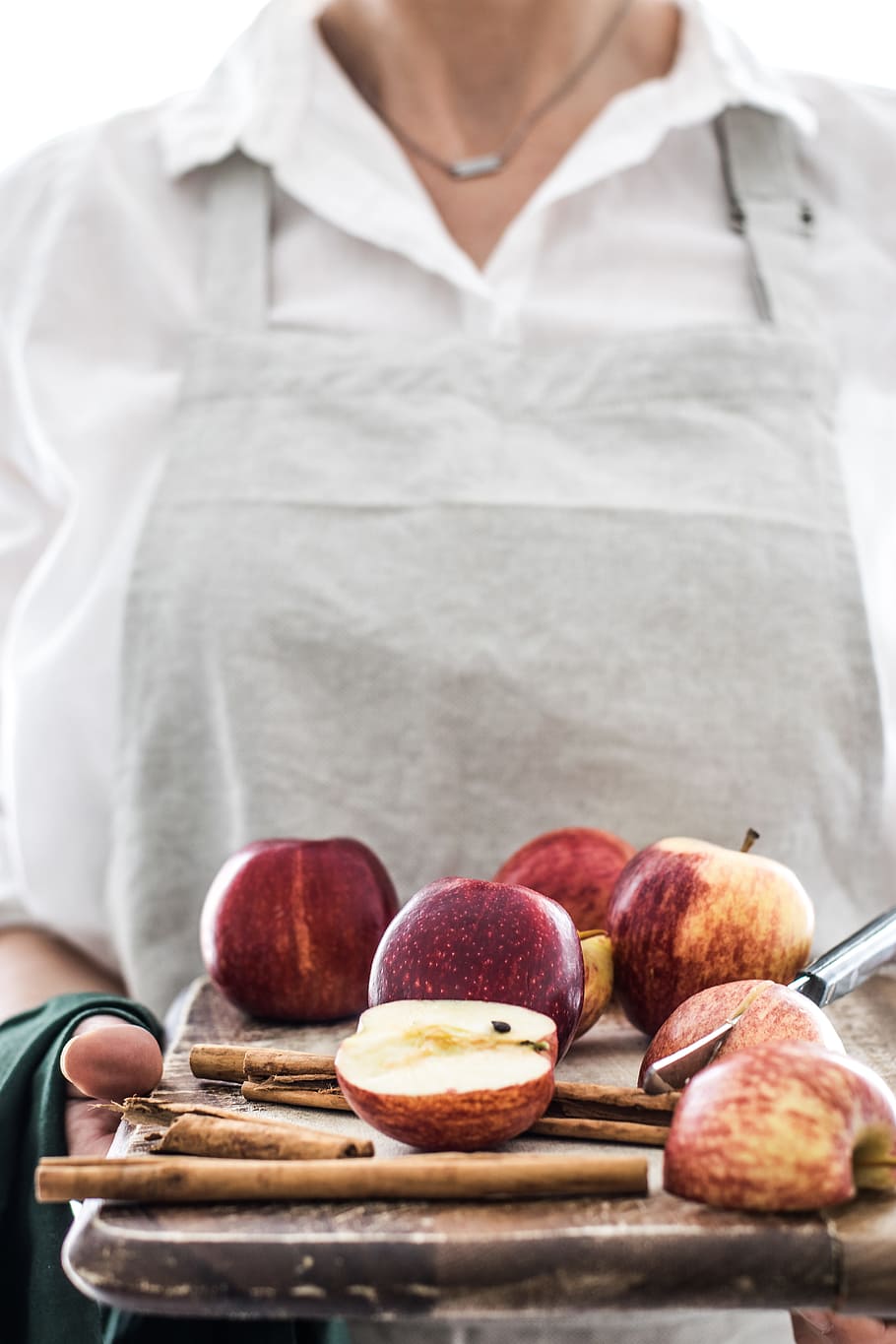 person holding tray of apples, fruit, board, cinnamon, spice HD wallpaper