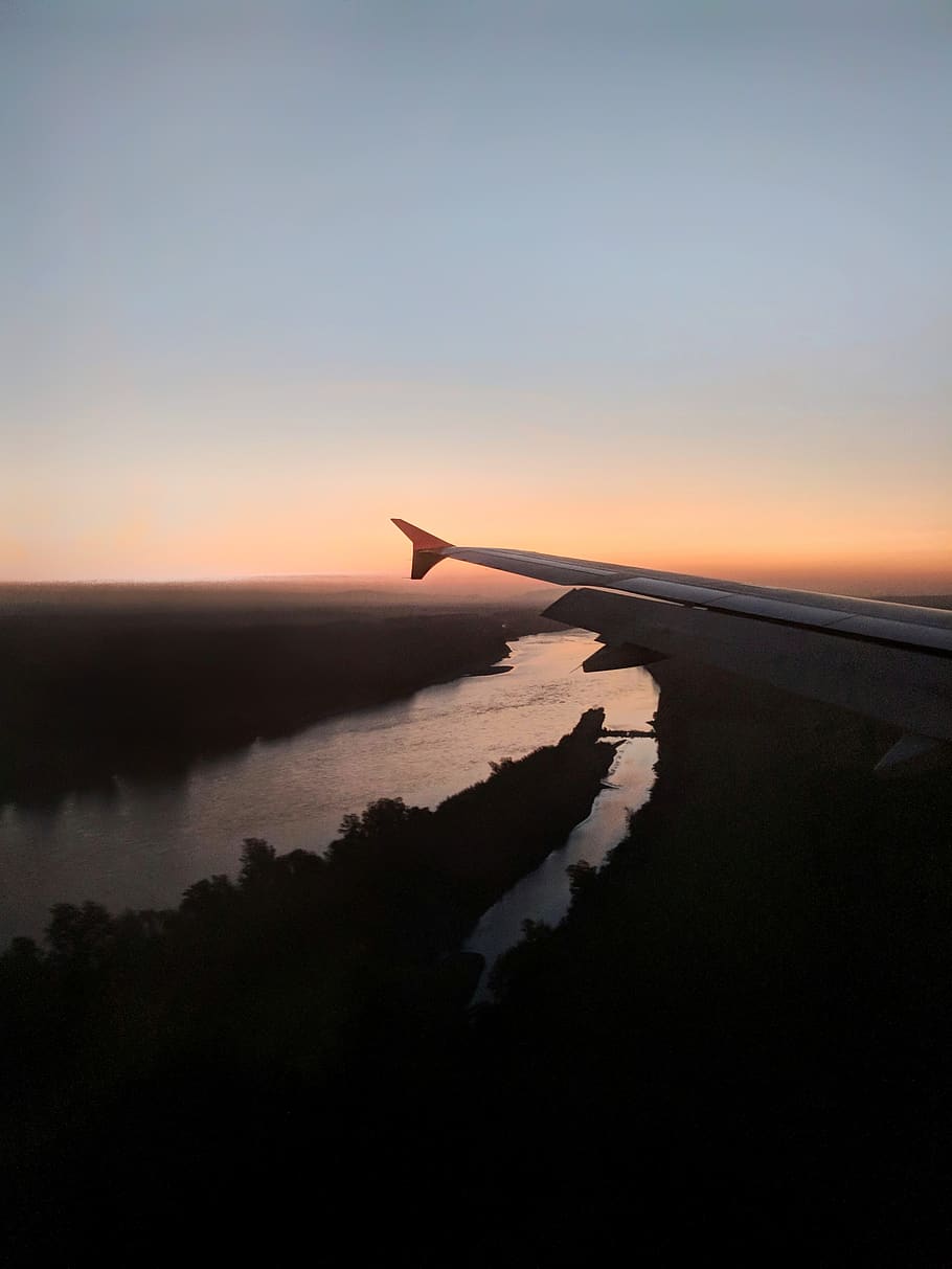 aircraft wingtip overlooking river at night time, nature, outdoors HD wallpaper