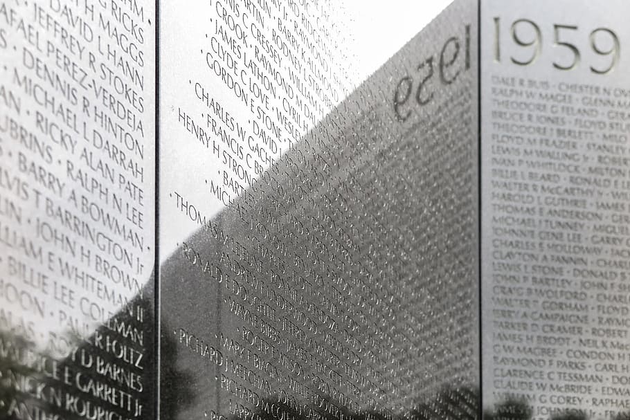 Names of war casualties and 1959 start date on Vietnam War Memorial in Washinton DC.
