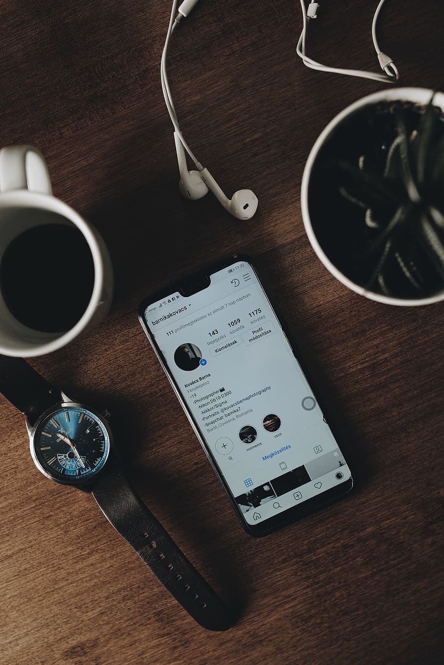 black Android smartphone beside the mug, table, still life, indoors HD wallpaper