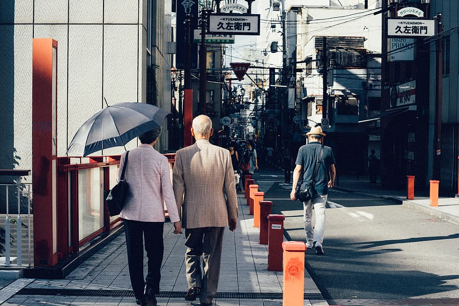 man and woman walking on concrete walkway, osaka, city, architecture HD wallpaper