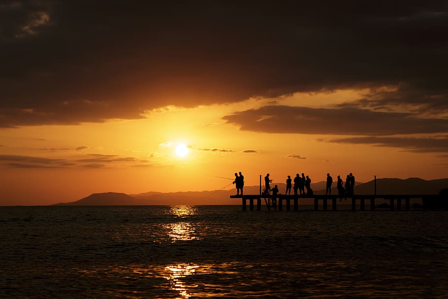 Crowd on Dock, background, clouds, dark, dawn, fishing, mountains HD wallpaper