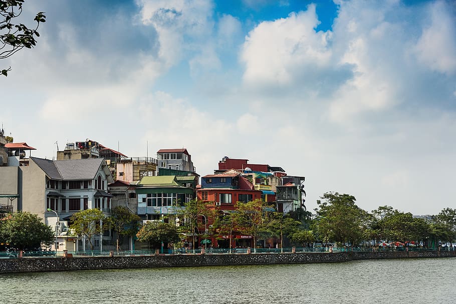 Assorted-color Buildings Near Water and Trees, architecture, clouds HD wallpaper