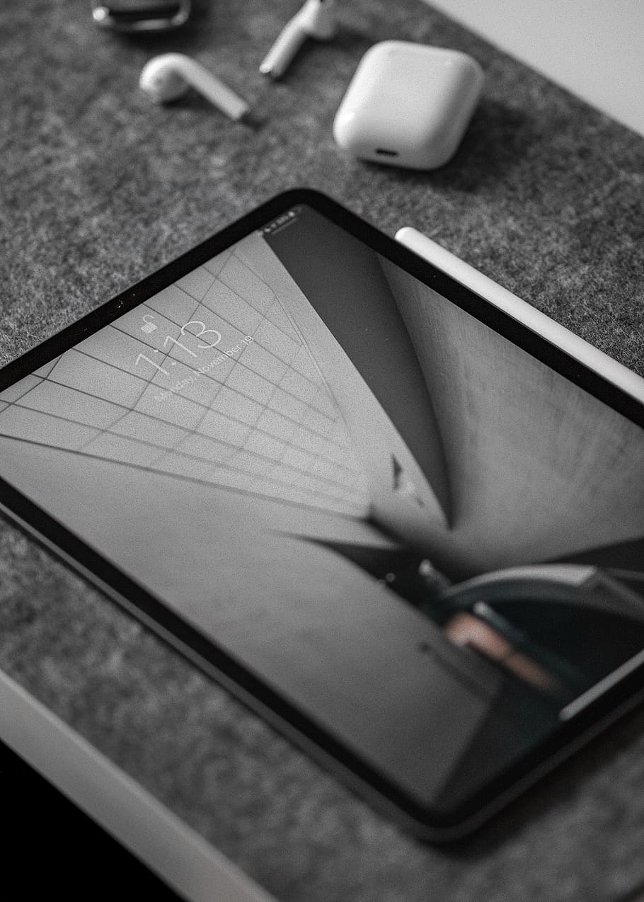 black iPad on gray surface, indoors, selective focus, close-up HD wallpaper