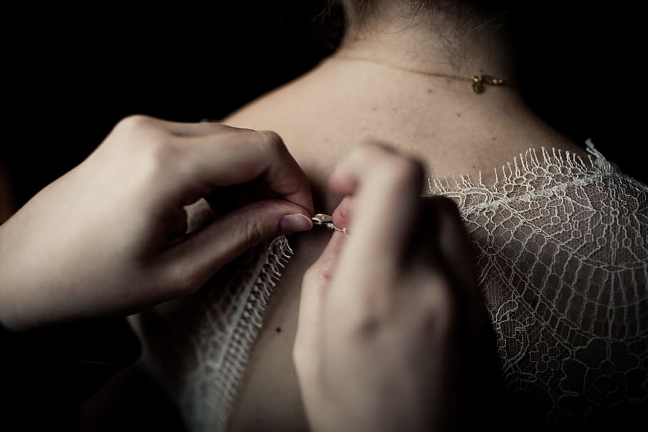 Person Buttoning White Shirt, back, hands, holding, lace, human hand HD wallpaper