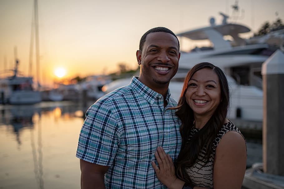 man and woman near white yacht, love, couple, happy, pnw, seattle