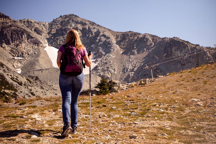 Woman Walking on Grass Field, adult, adventure, back view, backpack, HD wallpaper